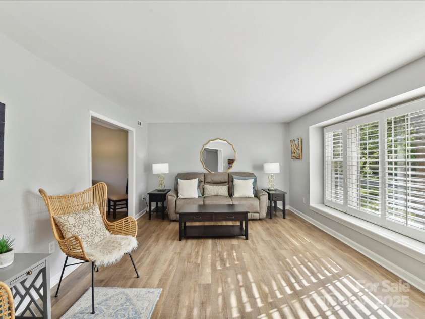 2315 Lawton Bluff Road, Charlotte, NC 28226.  MLS# CAR4255535, YatesRealty ID 19671. A large window with plantation shutters overlooks the front yard