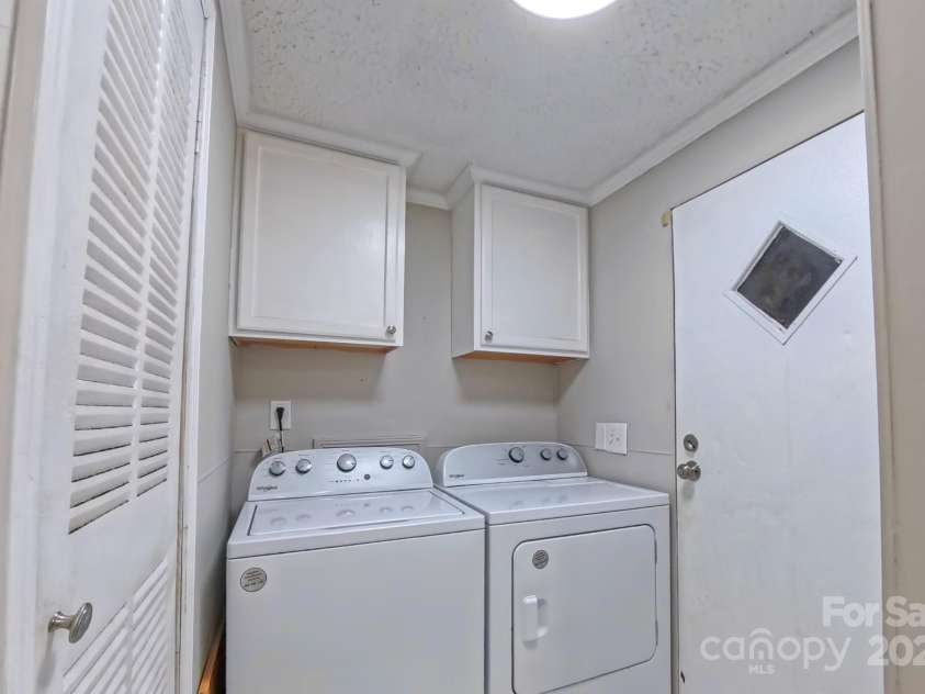8140 Karriker Road, Kannapolis, NC 28081.  MLS# CAR4250480, YatesRealty ID 19686. Laundry door leads to back deck