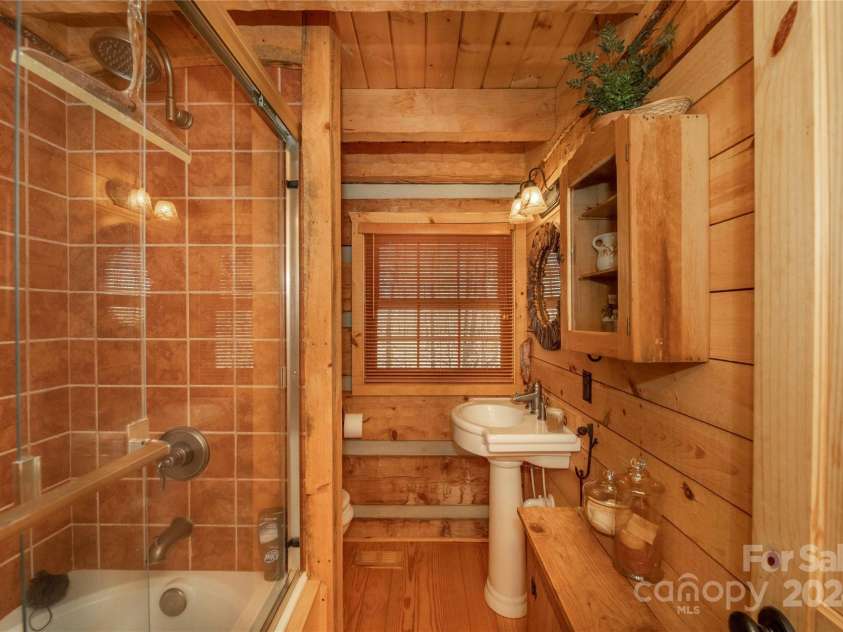 1074 Indian Camp Mountain Road, Rosman, NC 28772.  MLS# CAR4109820, YatesRealty ID 1970. Guest cabin bathroom