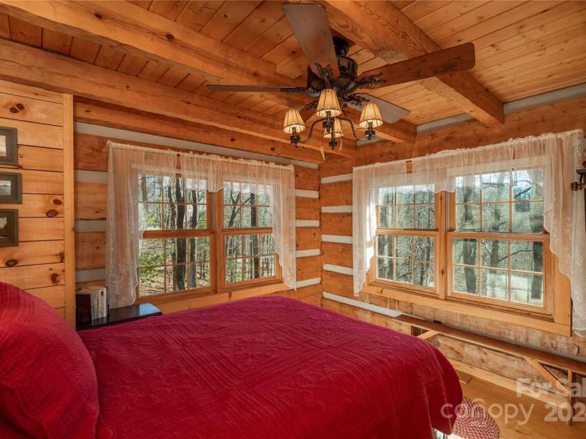 1074 Indian Camp Mountain Road, Rosman, NC 28772.  MLS# CAR4109820, YatesRealty ID 1970. Guest cabin bedroom