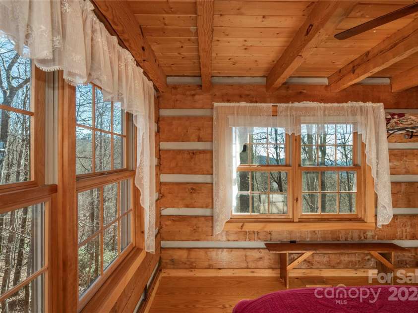 1074 Indian Camp Mountain Road, Rosman, NC 28772.  MLS# CAR4109820, YatesRealty ID 1970. Guest cabin bedroom