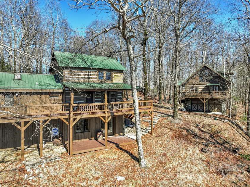 1074 Indian Camp Mountain Road, Rosman, NC 28772.  MLS# CAR4109820, YatesRealty ID 1970. Main cabin with guest cabin in distance