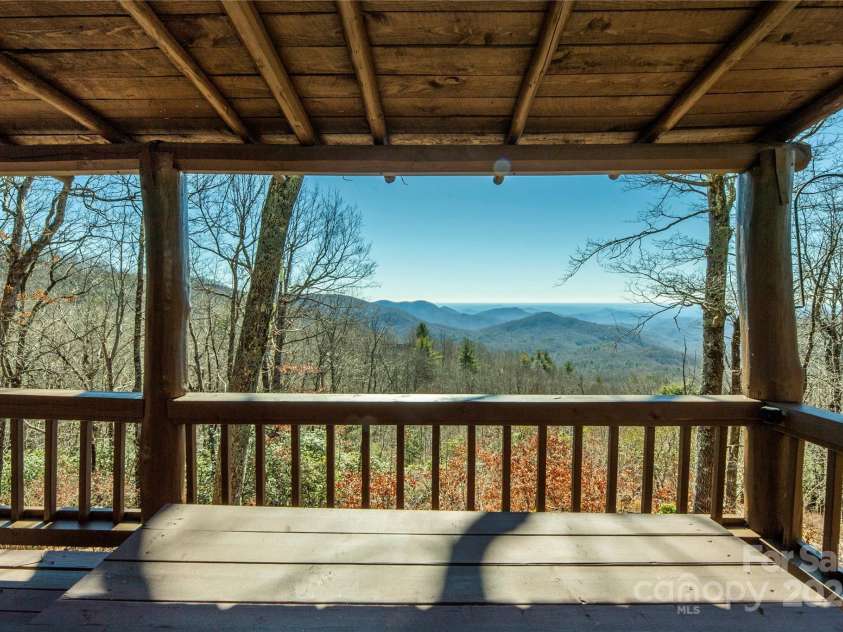 1074 Indian Camp Mountain Road, Rosman, NC 28772.  MLS# CAR4109820, YatesRealty ID 1970. Main house covered porch