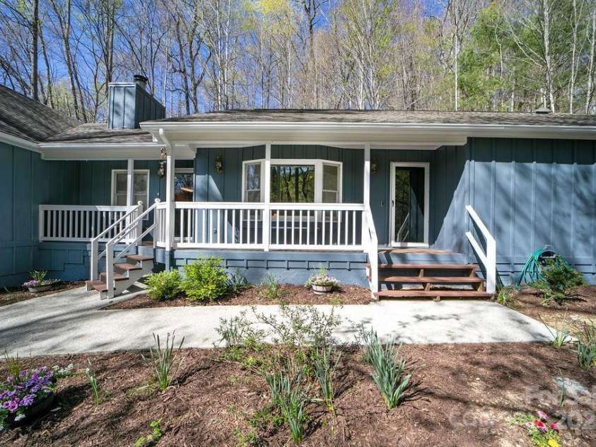 207 Aberdeen Lane, Pisgah Forest, NC 28768.  MLS# CAR4249386, YatesRealty ID 19704. Rocking Chair Front Porch