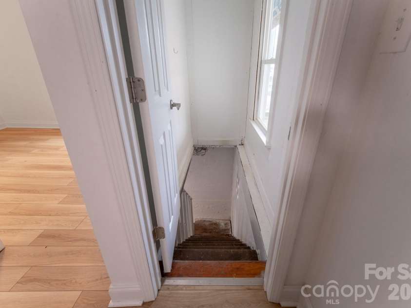 165 Kings Mill Road, Brevard, NC 28712.  MLS# CAR4347667, YatesRealty ID 19707. Stairs to basement