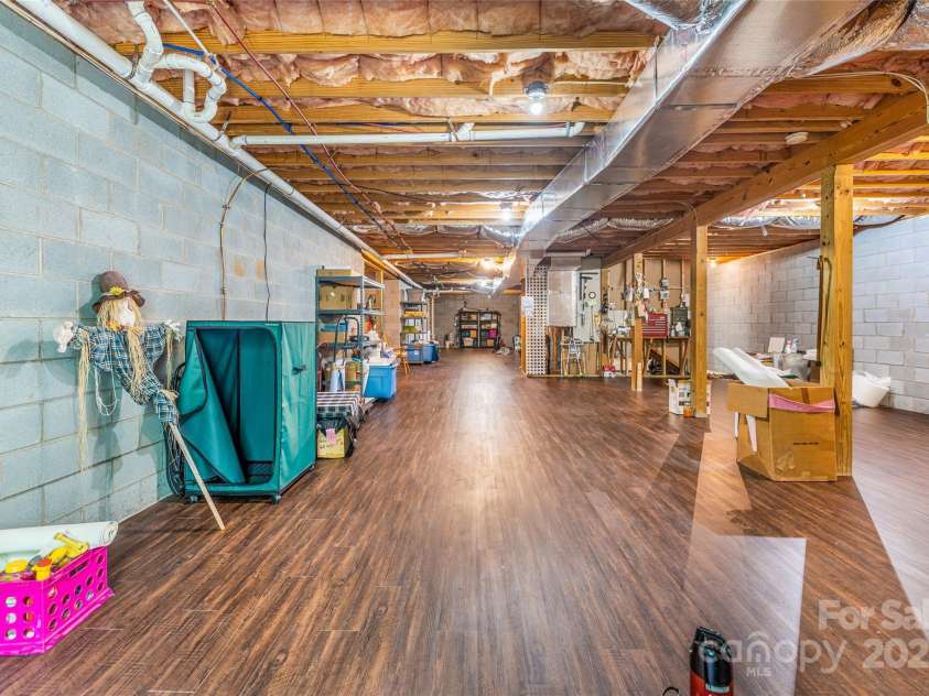 121 Ashe Bridge Road, Marion, NC 28752.  MLS# CAR4256500, YatesRealty ID 19710. Best looking basement I ever did see.