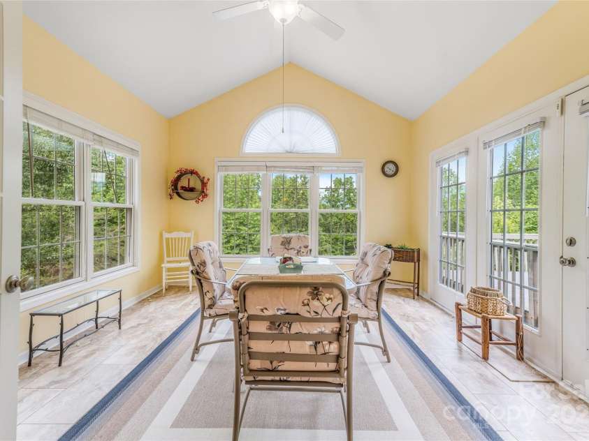 121 Ashe Bridge Road, Marion, NC 28752.  MLS# CAR4256500, YatesRealty ID 19710. Heart of the home! 4 season sun room perfect for dining, gathering, reading, growing plants etc.