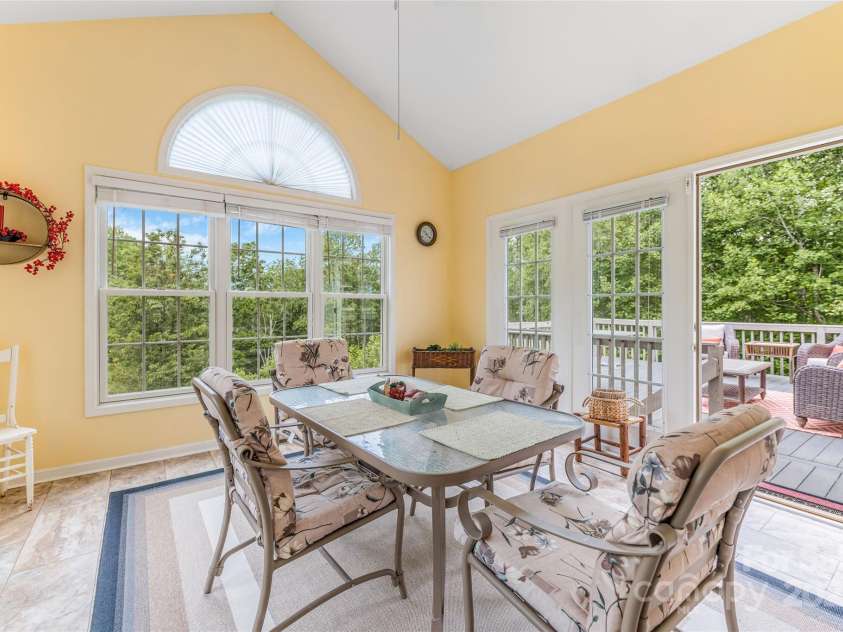 121 Ashe Bridge Road, Marion, NC 28752.  MLS# CAR4256500, YatesRealty ID 19710. Sunroom with access to back deck.