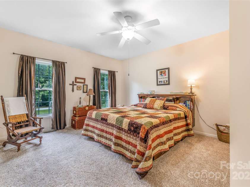 121 Ashe Bridge Road, Marion, NC 28752.  MLS# CAR4256500, YatesRealty ID 19710. Very Spacious primary Bedroom on main (off living room) with office, walk-in closet and bathroom attached.