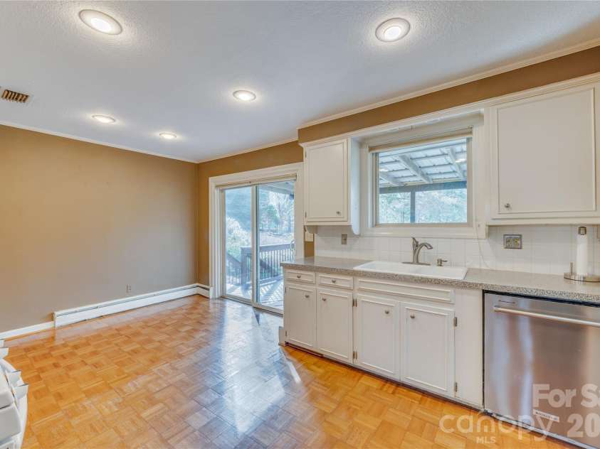 111 Kinwood Street, Morganton, NC 28655.  MLS# CAR4331530, YatesRealty ID 19711. Eat in kitchen leads to covered deck area.