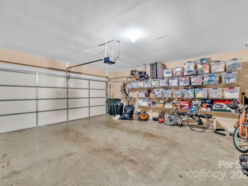 145 Fairway View Drive, Etowah, NC 28729.  MLS# CAR4267216, YatesRealty ID 19711. Garage (and organized!)