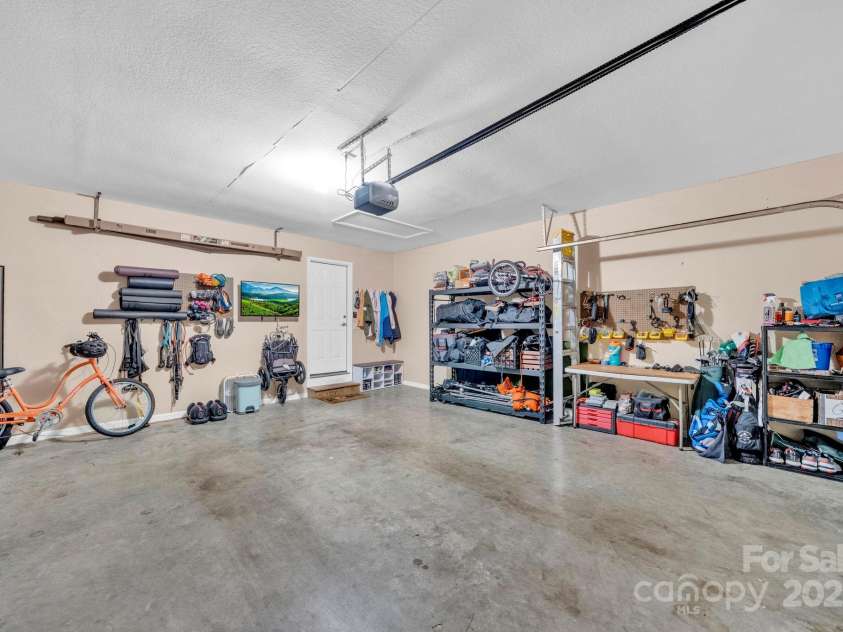 145 Fairway View Drive, Etowah, NC 28729.  MLS# CAR4267216, YatesRealty ID 19711. Garage (and organized!)