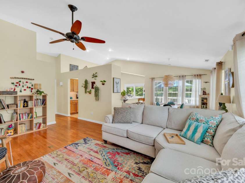 145 Fairway View Drive, Etowah, NC 28729.  MLS# CAR4267216, YatesRealty ID 19711. Living space looking into dining space