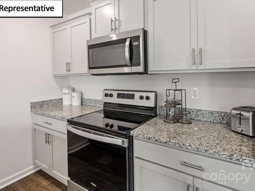 5912 Faron Way, Charlotte, NC 28262.  MLS# CAR4268514, YatesRealty ID 19718. Shaker cabinets, granite countertops, stainless steel appliances for microwave, dishwasher and range included