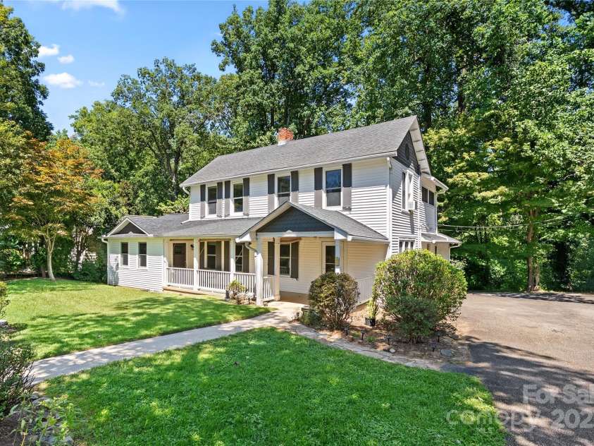 80 Laurel Avenue, Tryon, NC 28782.  MLS# CAR4299418, YatesRealty ID 1972. Downtown Tryon home in a great neighborhood! This 100 year old home includes a new attached studio apartment with a full kitchen, bath and even a walk in closet. High ceilings, plaster walls, and wood floors that are in great 