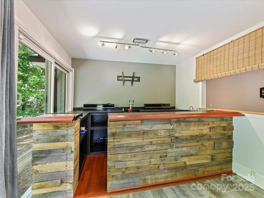 4301 Middle Stream Road, Charlotte, NC 28213.  MLS# CAR4249446, YatesRealty ID 19720. Bar in Sunroom