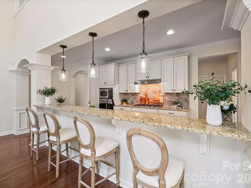 10620 Euclid Avenue, Concord, NC 28027.  MLS# CAR4354098, YatesRealty ID 19722. Huge breakfast bar with pendant lighting