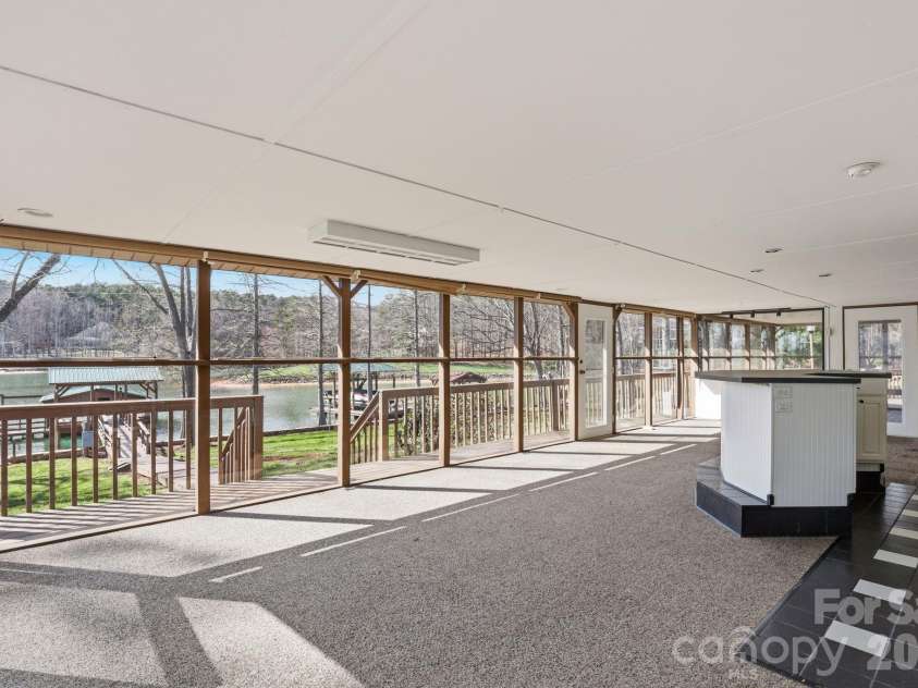 236 Apache Road, Troutman, NC 28166.  MLS# CAR4359171, YatesRealty ID 19726. Sunroom with full bar and sink area.