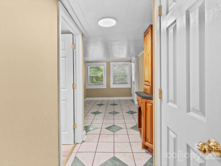 405 7th Street, Spencer, NC 28159.  MLS# CAR4185619, YatesRealty ID 19730. Sunroom, Ceilings are not 8 ft