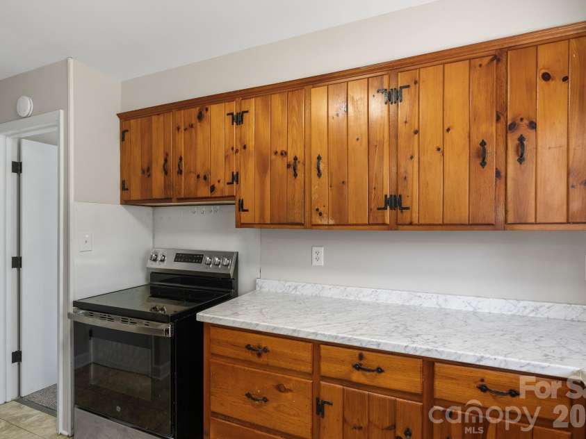 19 Browndale Road, Asheville, NC 28805.  MLS# CAR4338524, YatesRealty ID 19731. Leads to primary bedroom separate from other 3 rooms