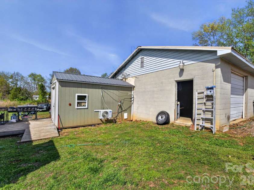 4163 Horseshoe Bend Road, Hudson, NC 28638.  MLS# CAR4368416, YatesRealty ID 19733. Outbuilding with HVAC, electric, sink and water heater