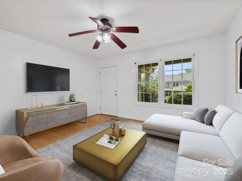 23 Aberdeen Drive, Arden, NC 28704.  MLS# CAR4258815, YatesRealty ID 19735. Family Rm. Digitally staged.