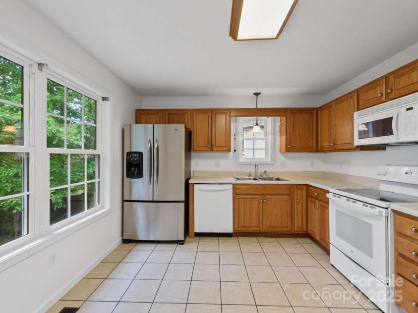 23 Aberdeen Drive, Arden, NC 28704.  MLS# CAR4258815, YatesRealty ID 19735. Large kitchen. Refrigerator conveys.
