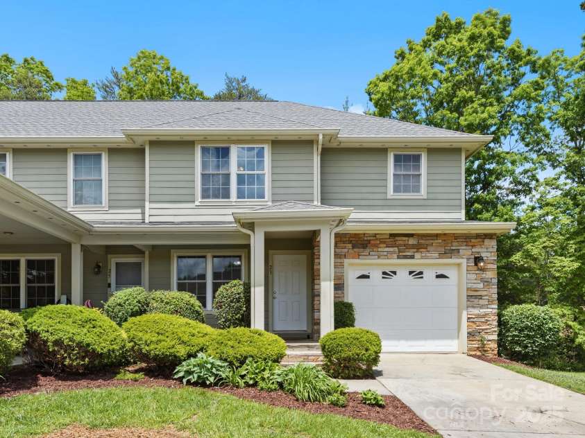 23 Aberdeen Drive, Arden, NC 28704.  MLS# CAR4258815, YatesRealty ID 19735. Mature landscaping & handsome exterior.