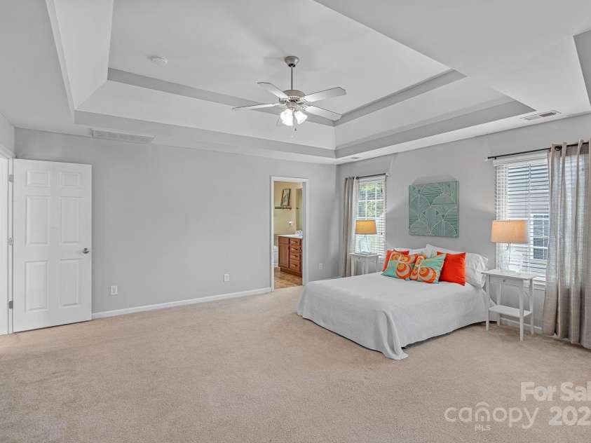 2043 Covered Bridge Court, Rock Hill, SC 29732.  MLS# CAR4285482, YatesRealty ID 19738. 3 tiered tray ceiling in Primary bedroom & lighted ceiling Fan!