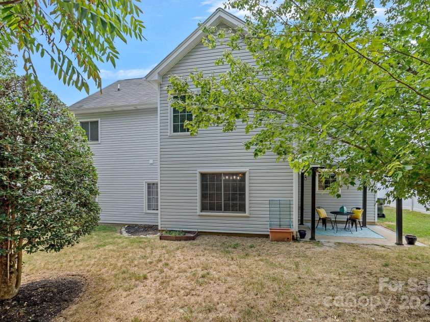 2043 Covered Bridge Court, Rock Hill, SC 29732.  MLS# CAR4285482, YatesRealty ID 19738. Exterior back yard view.  Mature trees, yard with privacy Fence-Sereen!