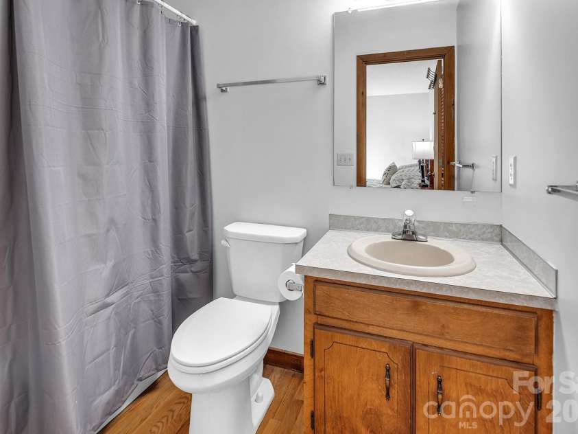 226 Balsam Circle, Troy, NC 27371.  MLS# CAR4341401, YatesRealty ID 1974. Main level secondary bedroom with en suite bathroom.