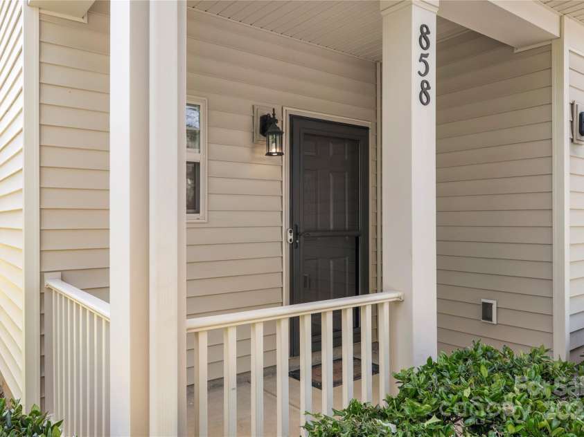 858 Rook Road, Charlotte, NC 28216.  MLS# CAR4269676, YatesRealty ID 19743. Covered front porch is perfect for a spring day