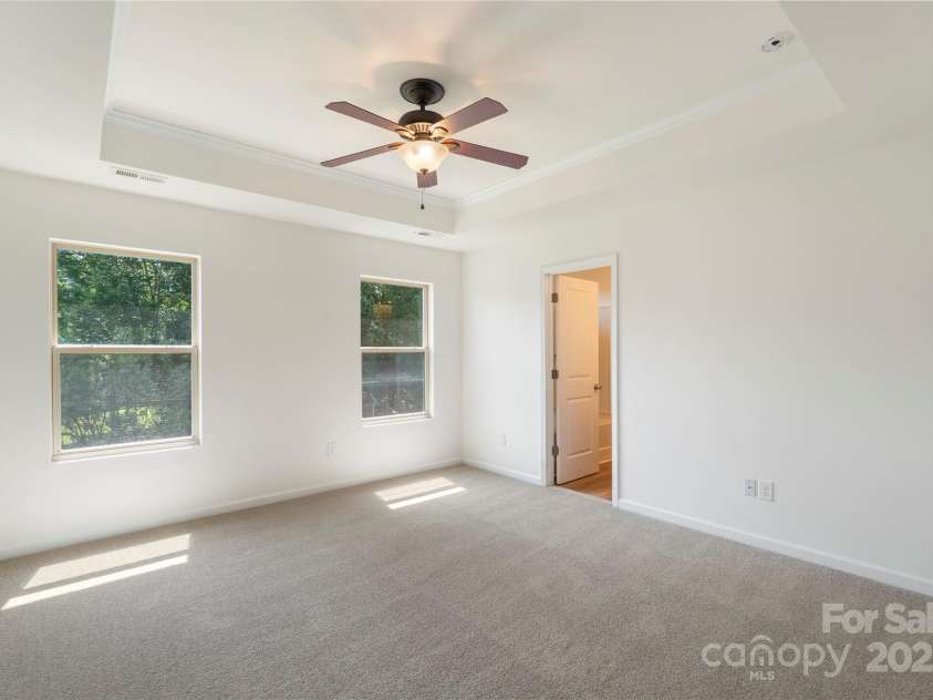858 Rook Road, Charlotte, NC 28216.  MLS# CAR4269676, YatesRealty ID 19743. Large Primary Bedroom  with a tray ceiling