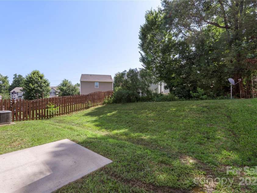 858 Rook Road, Charlotte, NC 28216.  MLS# CAR4269676, YatesRealty ID 19743. Privacy is king here with a tree lined back yard