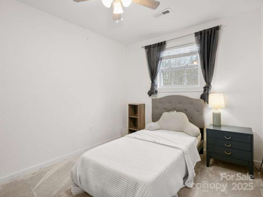 10 Bear Trail, Fairview, NC 28730.  MLS# CAR4232914, YatesRealty ID 19748. Bonus room.
