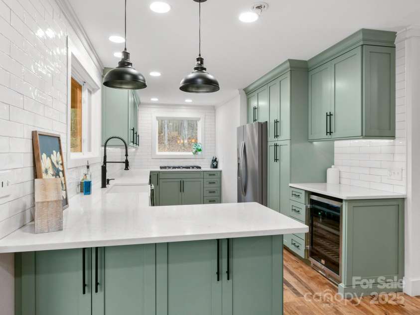 10 Bear Trail, Fairview, NC 28730.  MLS# CAR4232914, YatesRealty ID 19748. Gorgeous custom kitchen complete with beverage refrigerator.