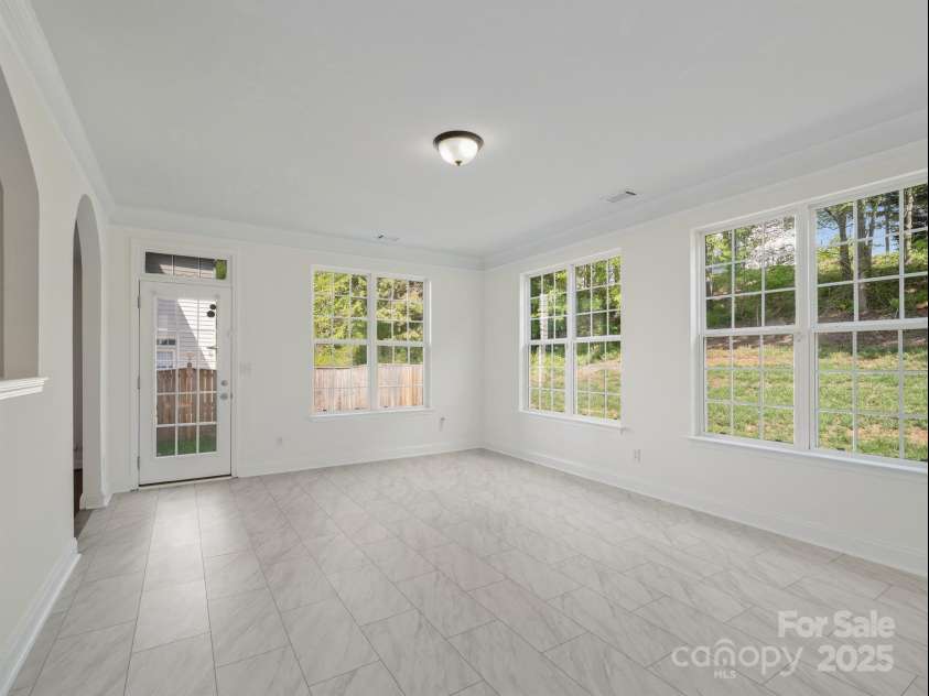 10032 Montrose Drive, Charlotte, NC 28269.  MLS# CAR4225271, YatesRealty ID 19752. Sunroom empty