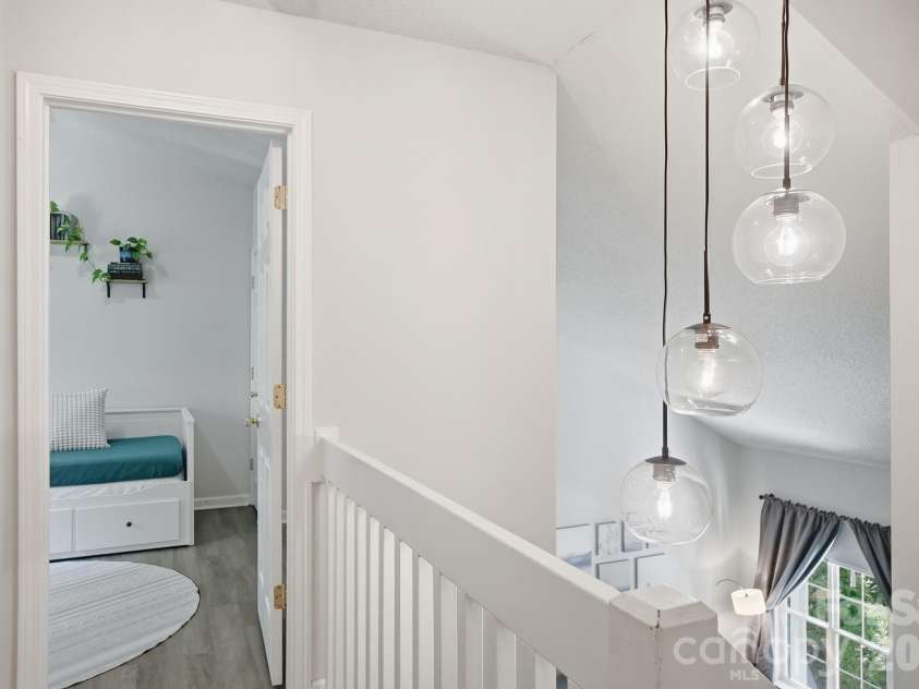 8170 Rudolph Road, Charlotte, NC 28216.  MLS# CAR4373244, YatesRealty ID 19752. Exquisite lighting add additional charm and character