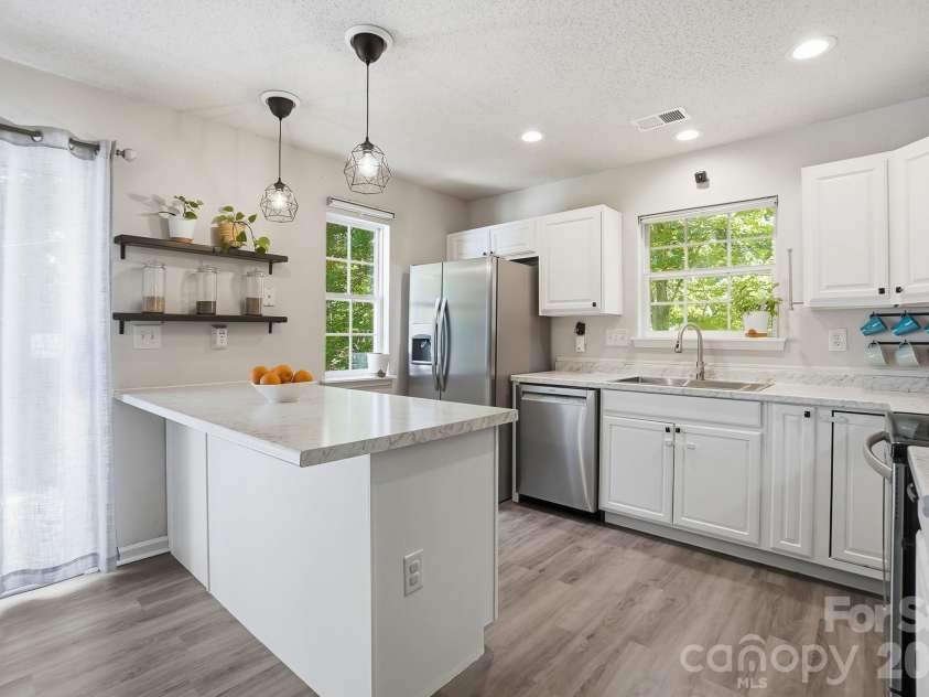 8170 Rudolph Road, Charlotte, NC 28216.  MLS# CAR4373244, YatesRealty ID 19752. Modern cabinets in the kitchen