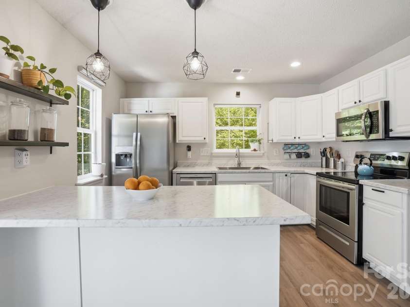 8170 Rudolph Road, Charlotte, NC 28216.  MLS# CAR4373244, YatesRealty ID 19752. This kitchen is the perfect entertaining space