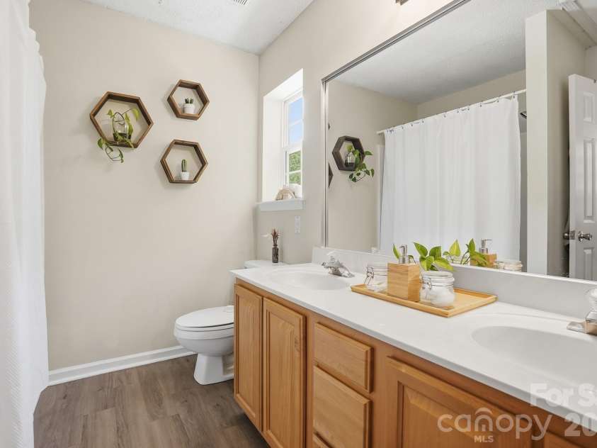 8170 Rudolph Road, Charlotte, NC 28216.  MLS# CAR4373244, YatesRealty ID 19752. Upstairs hall bath