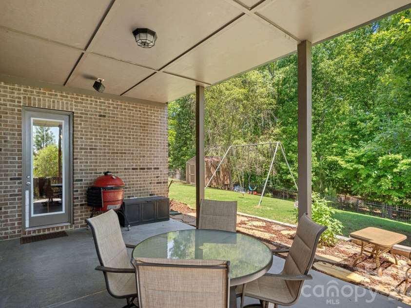 897 Tyne Drive, Fort Mill, SC 29715.  MLS# CAR4374930, YatesRealty ID 19758. Covered back patio.