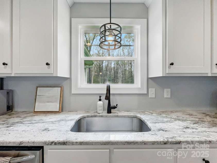 3018 Corinth Church Road, Monroe, NC 28112.  MLS# CAR4242550, YatesRealty ID 19771. Kitchen sink with window