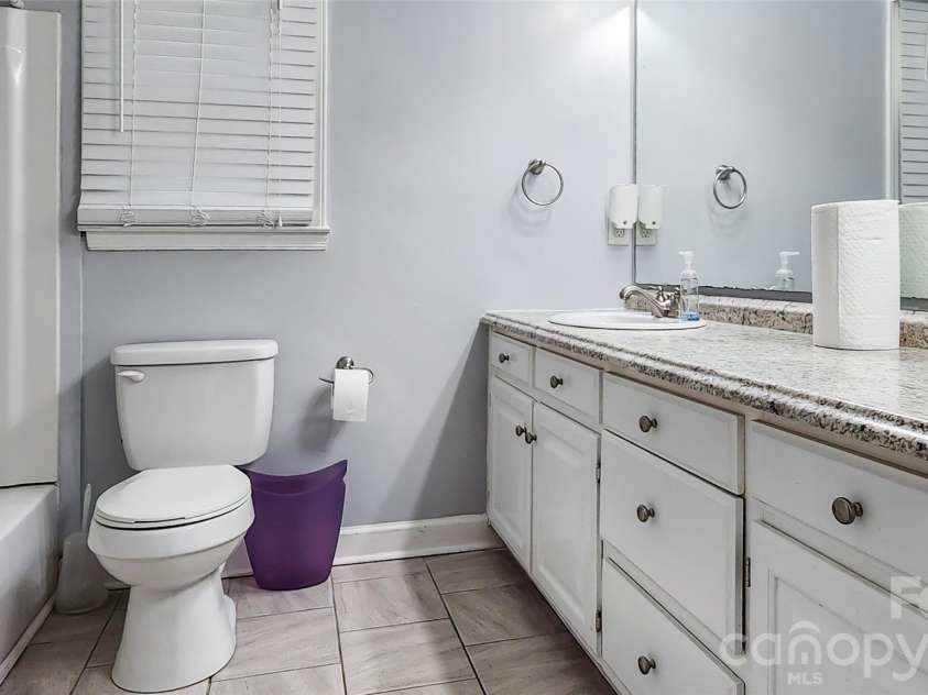 8331 Dunstaff Road, Charlotte, NC 28269.  MLS# CAR4369538, YatesRealty ID 19771. Upstairs Hall Full Bath