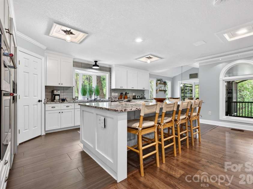 170 Weston Road, Arden, NC 28704.  MLS# CAR4379602, YatesRealty ID 19778. Kitchen island seats 6