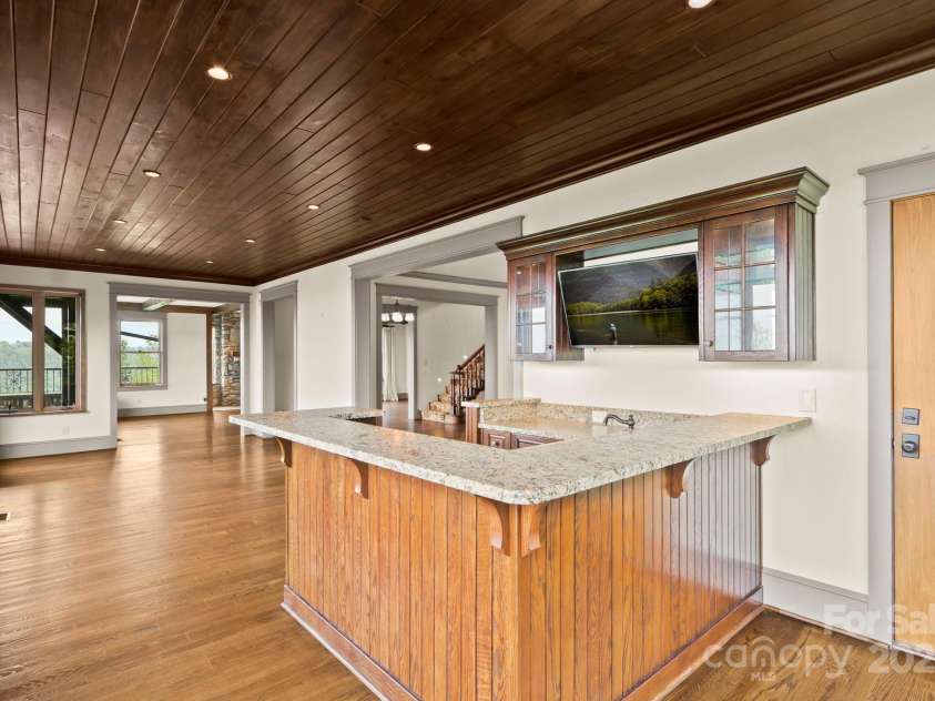 1245 Laurel Lane, Blowing Rock, NC 28605.  MLS# CAR4228582, YatesRealty ID 19780. Bar & Living with views and deck access!