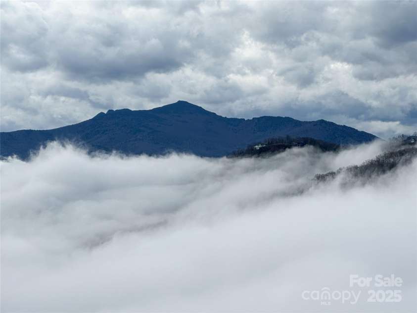 1245 Laurel Lane, Blowing Rock, NC 28605.  MLS# CAR4228582, YatesRealty ID 19780. Grandfather Mountain, zoomed, peeking above the clouds...