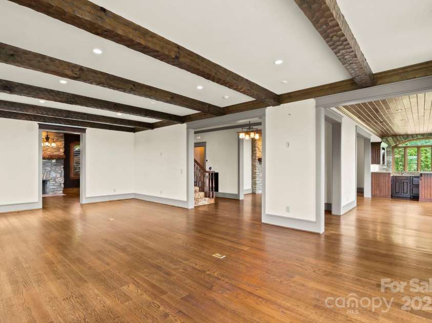 1245 Laurel Lane, Blowing Rock, NC 28605.  MLS# CAR4228582, YatesRealty ID 19780. Living Room open to dining, sunroom/bar, study, w/ Half Bath off hall (not shown)- GREAT flow for entertaining!...