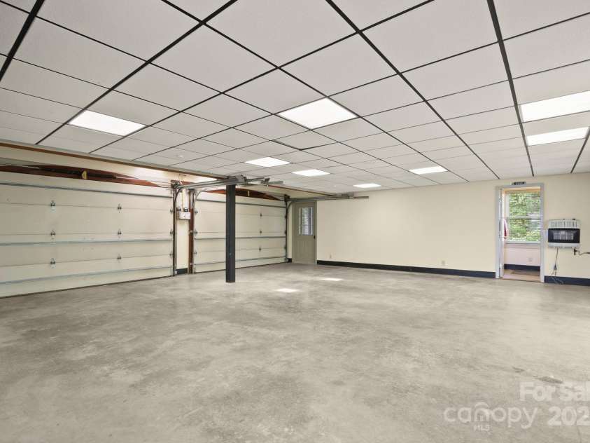 1245 Laurel Lane, Blowing Rock, NC 28605.  MLS# CAR4228582, YatesRealty ID 19780. Oversized garage with bath, storage, and tons of space.