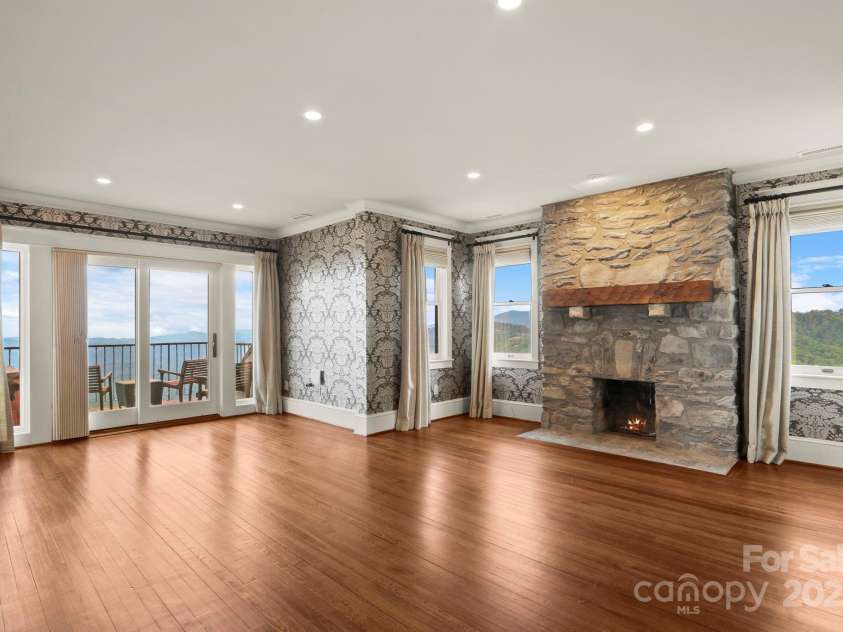 1245 Laurel Lane, Blowing Rock, NC 28605.  MLS# CAR4228582, YatesRealty ID 19780. Primary Suite w/ fireplace, views, private balcony with hot tub....
